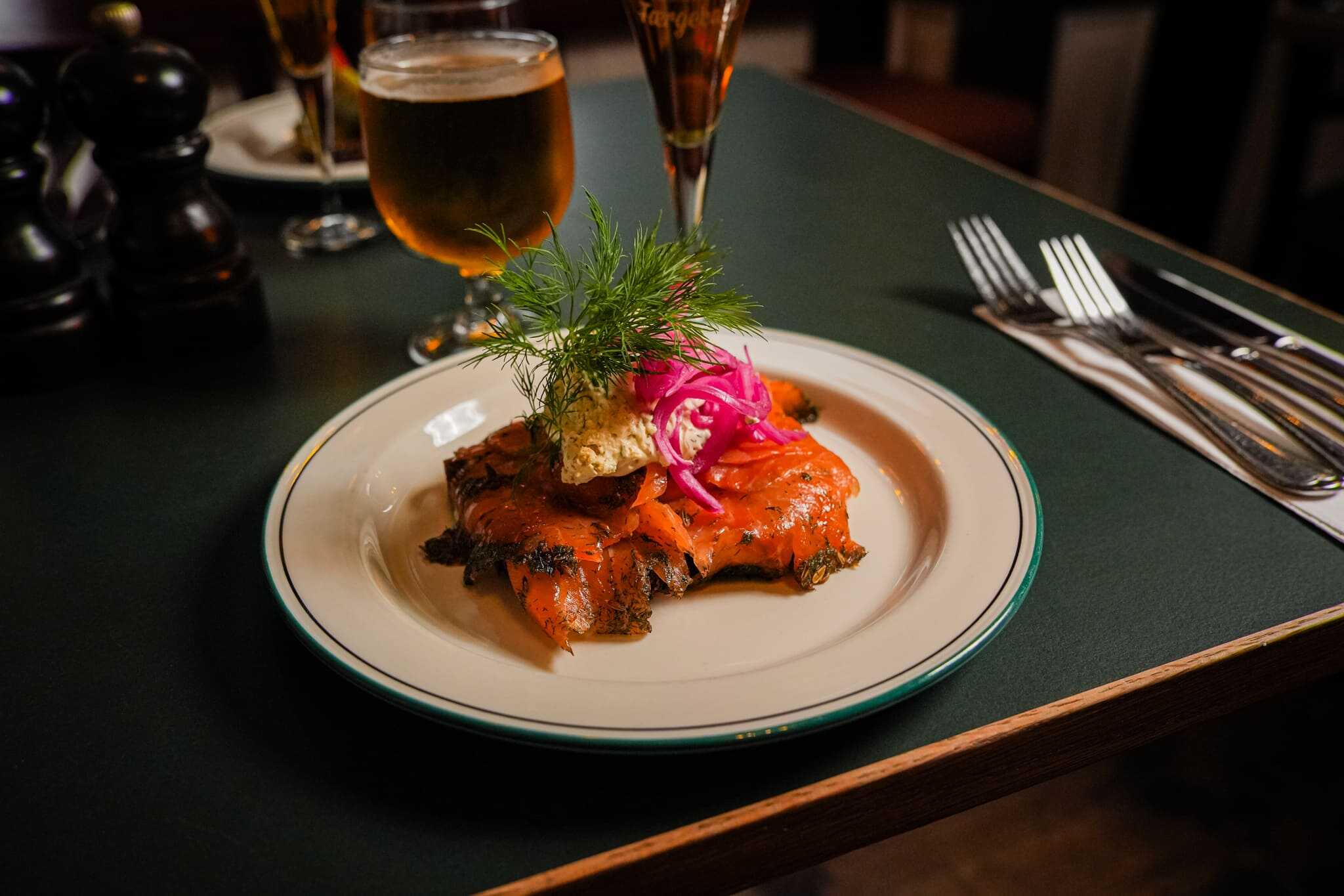 Open-faced sandwich on a plate with gravad lax