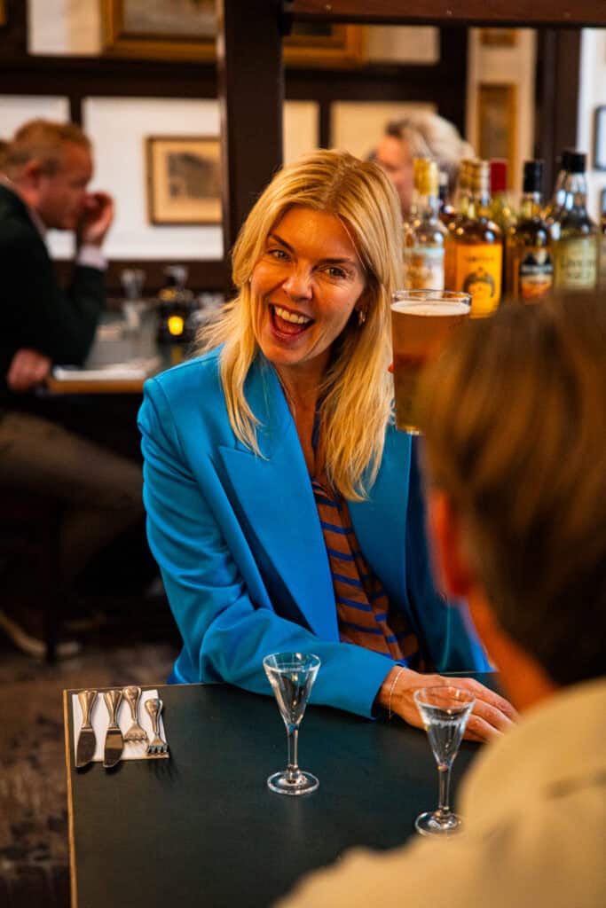 Woman sitting at table smiling